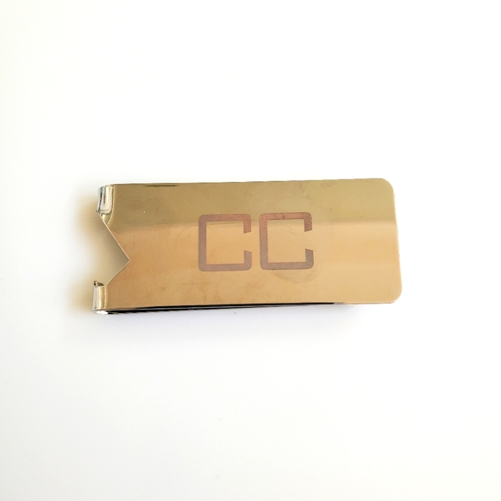 money clip/beverage opener

Initials "CC"